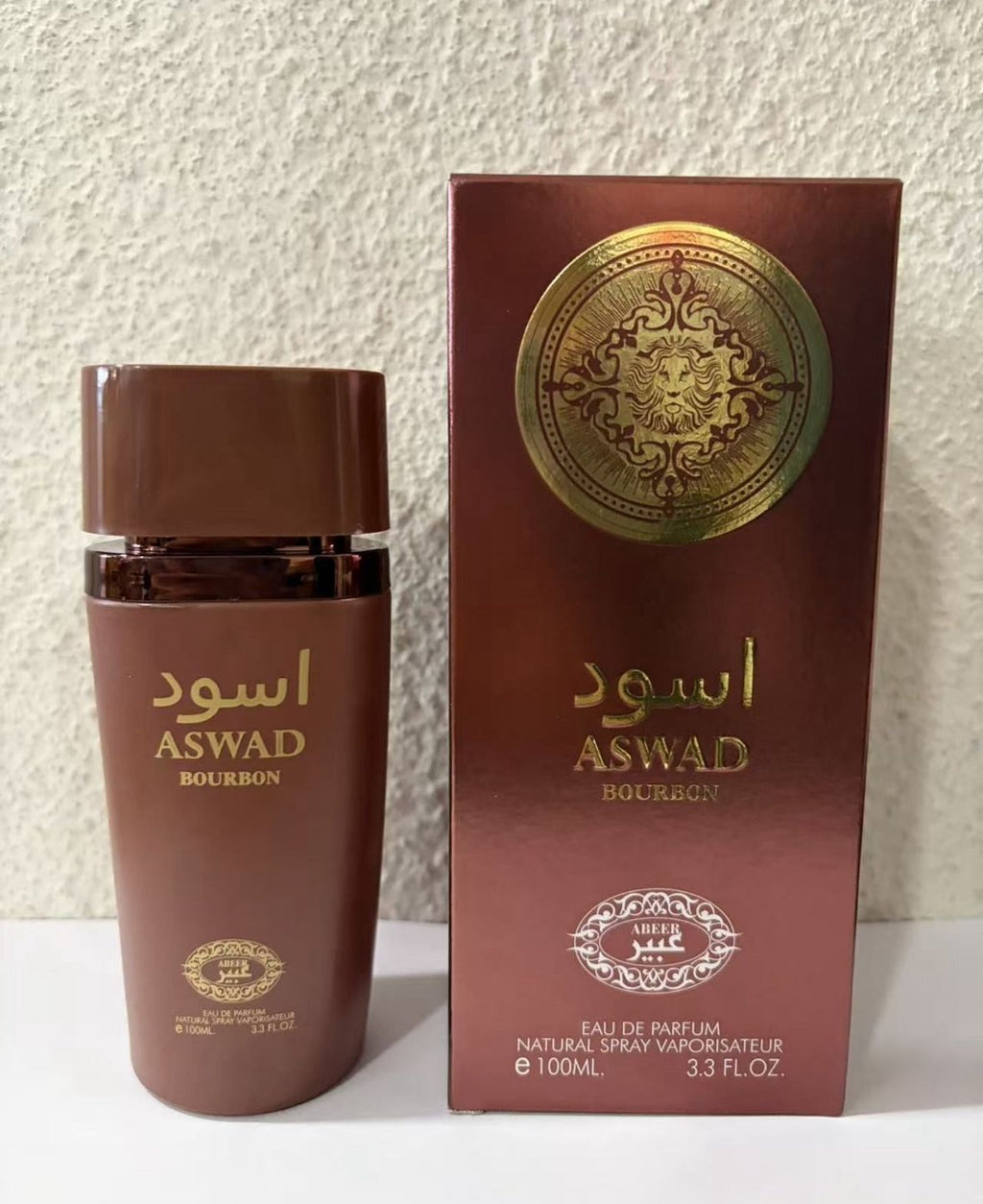 Perfume árabe para hombre ASWAD Bourbon de 100ml Eau de Parfum en frasco tono café con detalles dorados y su caja original